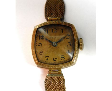 ROLEX; a lady's vintage 18ct yellow gold wristwatch, the rounded rectangular dial set with Arabic numerals, with fifteen jewe