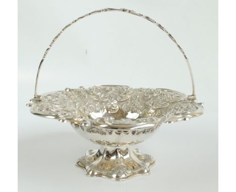 MARTIN HALL & CO; a Victorian hallmarked silver shaped circular fruit basket elaborately embossed with foliate scrolls and fl