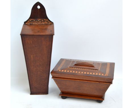 A 19th century mahogany sarcophagus tea caddy with inlaid banding, the hinged lid enclosing two sections, width 31cm, and a 1