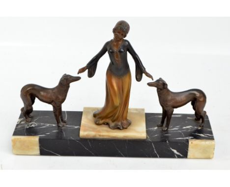 R. SCALI; a 1930s Art Deco mantelpiece sculpture modelled as a spelter female figure flanked by two hounds on rectangular two