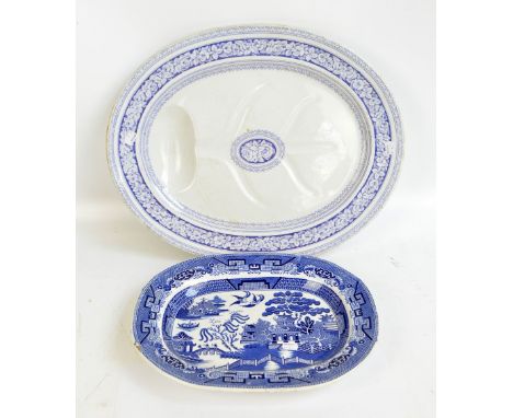 A late 19th century ceramic 'Grecian' blue and white floral transfer decorated turkey platter, 55 x 45cm and a further smalle