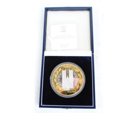 A cased 'Her Majesty The Queen Golden Jubilee 1952-2002' Alderney 1kg £50 silver coin with specification leaflet (case af).