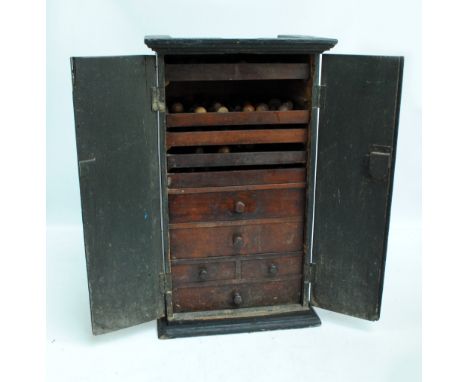 A vintage two door tool cabinet containing approximately ninety picks, chisels and other tools. The vendor's father, Rex Meak