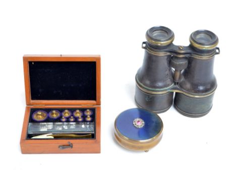 A cased set of plates with tweezers, an early 20th century pair of field glasses, and a brass trinket box with a large detach