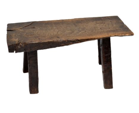 A rustic elm topped pig bench raised on four substantial rectangular section legs, length 93cm.