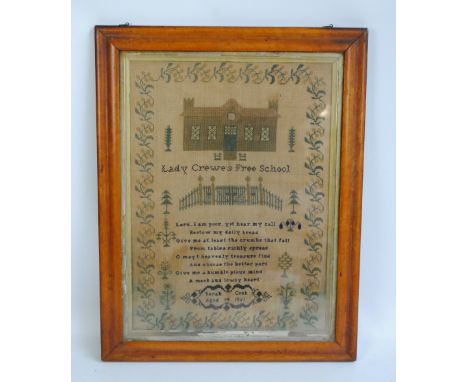 A Victorian worked sampler with depiction of Lady Crewe's Free School and the school gate surrounded by a floral border, with
