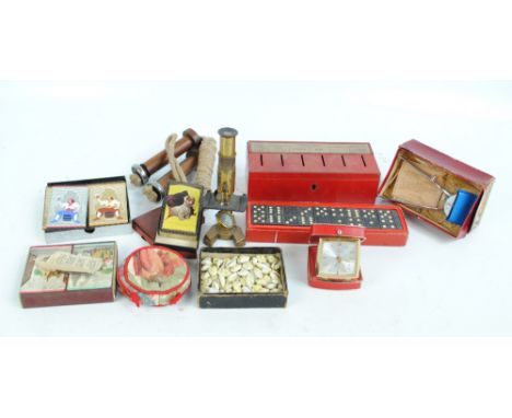 A small lot of various collectors' items to include dominoes, thrift box, playing cards, a collection of shells, a boxed Prän