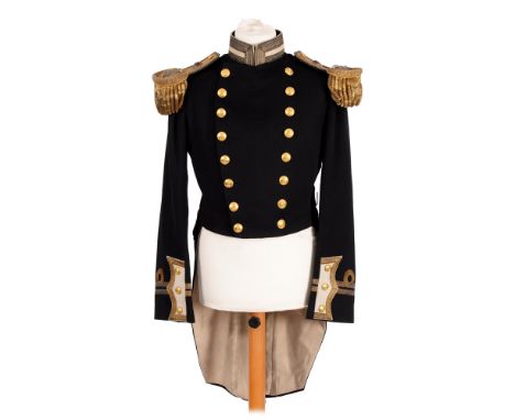 Royal Navy.&nbsp;Uniform full dress coat of a captain with epaulettes, shoulder tabs and sword belt, japanned tin with engrav