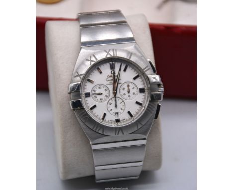 An Omega Constellation Double Eagle Co-Axial Escapement Automatic Chronograph Wristwatch with white dial & steel bezel, integ