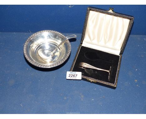 A Silver pusher, Birmingham and a sterling Silver Sauce boat and ladle.