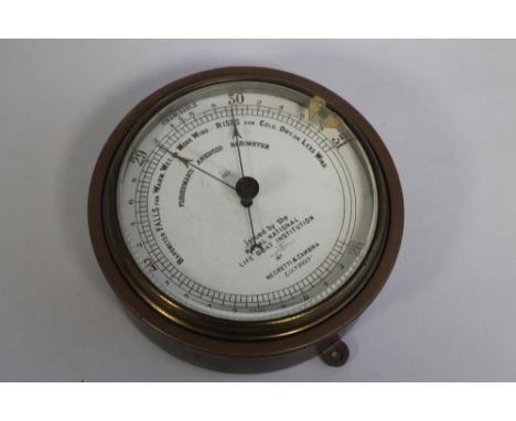 A METAL CASED BAROMETER marked 'Fisherman's Aneroid Barometer, issued by the Royal National Lifeboat Institution', maker's na