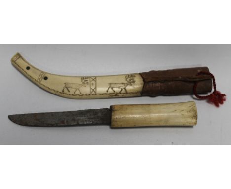 AN INUIT TYPE HUNTING KNIFE, BONE GRIP AND SCABBARD, the scabbard decorated with reindeer, L 27 cm