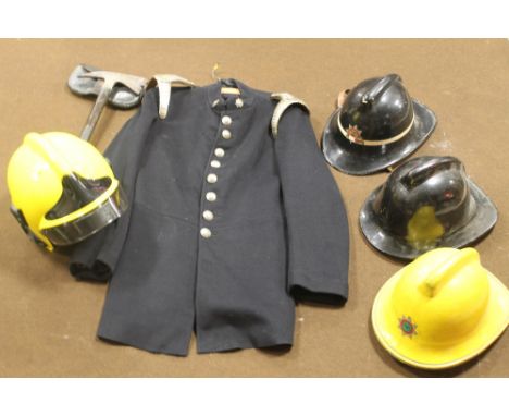 A VINTAGE 1940S FIRE BRIGADE TUNIC, together with a Chillington Arpax ARP axe in leather case, three cork fire helmets (Staff