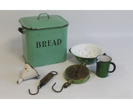 KITCHENALIA - a quantity of enamel wares to include a green bread bin, measuring jug, funnel etc.