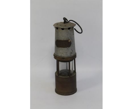 A MINER'S LAMP marked 'J. H. Naylor, Wigan'