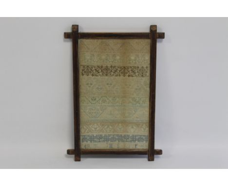 A LATE 17TH CENTURY SAMPLER dated 1690,showing various bands of pattern, in an Oxford type frame, 36 x 23 cm (not including f
