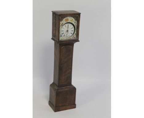 A TREEN POCKET WATCH HOLDER, in the form of a longcase clock, currently fitted with a pocket watch movement, H 30.5 cm