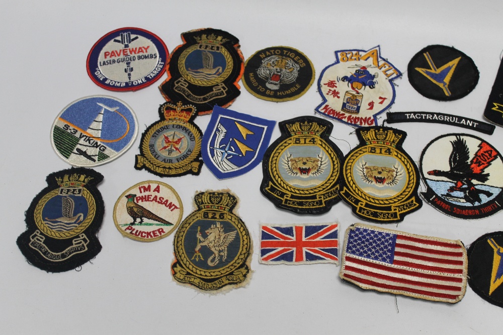 A COLLECTION OF MILITARY CLOTH BADGES, mostly blazer types to include ...