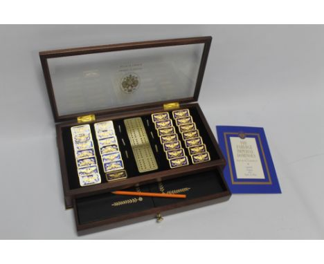 THE FABERGÉ IMPERIAL DOMINOES' by the House of Fabergé, from an original design with 28 gold plated guilloche inlay dominoes 