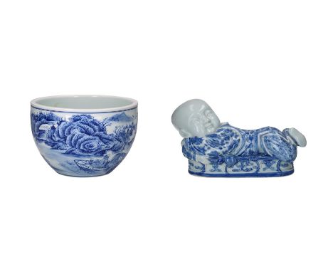 A blue and white porcelain bowl, decorated with a mountainous river landscape and boats. Marked with 6-character mark Kangxi.