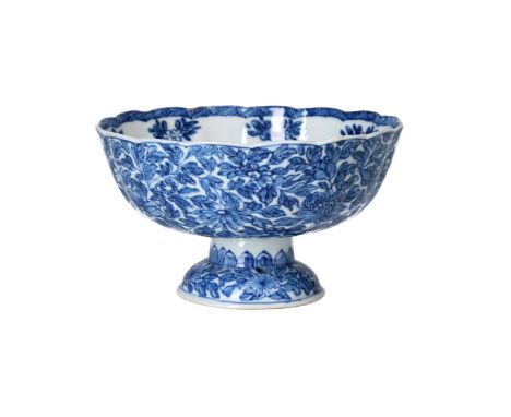 A blue and white porcelain lobed tazza with scalloped rim, decorated with flowers. Marked with symbol Kangxi. China, Kangxi.H