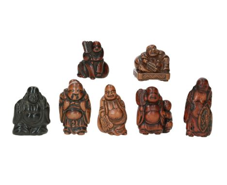 Lot of seven netsuke, 1) boxwood, standing Hotei carrying karako in his bag. H. 5.5 cm. 2) boxwood, standing Hotei with fan a