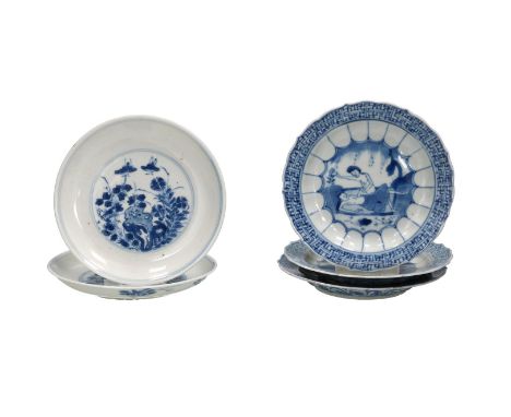 Lot of five blue and white porcelain saucers, two with a floral decoration and three with an ribbed edge in relief and a deco
