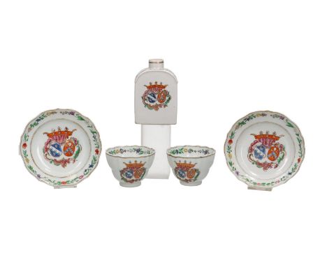 A pair of porcelain Chine de commande cups, with ears, and saucers, with scalloped rim, complemented with a tea caddy. All de