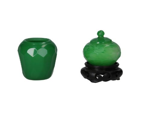 Two cut jade green glass jars, a lidded jar on a wooden base and a conical jar. China 20th century,H. 6.5 - 8.5 cm.Condition 