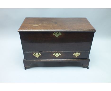 A 19TH CENTURY MINIATURE SIZED MULE TYPE CHEST of plain box form, having lift-up lid with vacant interior, over single full w