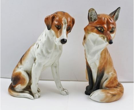 A ROYAL WORCESTER BONE CHINA SEATED FOX HOUND, no. 2994, 18cm high, together with a FOX no. 2993, 19cm high (2) 