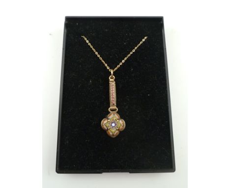A VICTORIAN MICRO MOSAIC GOLD MOUNTED PENDANT, comprising a floret with salmon pink, olive green, white and orange micro tile