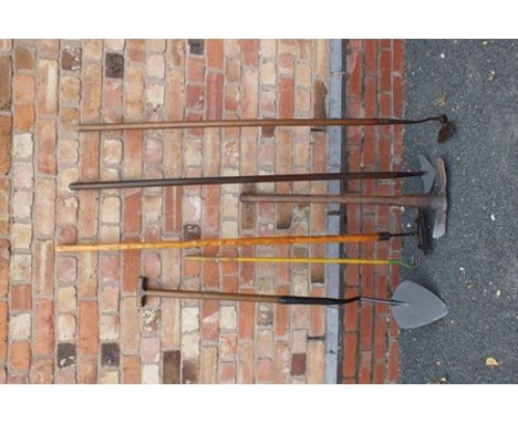 A SELECTION OF VINTAGE GARDEN TOOLS to include; a turf cutter, pick, weeders and other items 