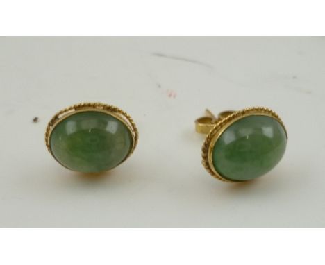 A PAIR OF JADE EARRINGS set in 18k gold mounts 