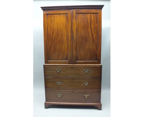 A 19TH CENTURY MAHOGANY SECRETAIRE WITH LINEN PRESS TOP, the upper section having dentil cornice over two plain panelled cupb