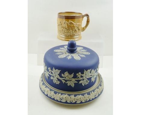 A LATE VICTORIAN CHEESE BELL AND BASE, having cobalt blue body with applied floral decoration, the cover with an acorn finial