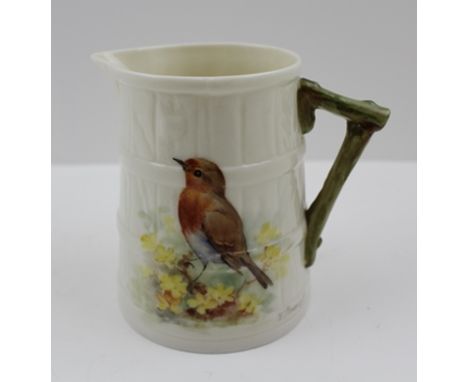W. POWELL A ROYAL WORCESTER CREAM JUG painted with a robin amongst yellow flowers on a cream ground, with a green painted bra