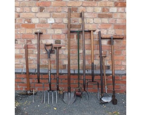 A SELECTION OF VINTAGE GARDEN TOOLS including; Atco lawn edger, two wooden -handled shafted fork, cutter, three various garde