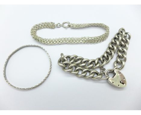 Two silver bracelets and a baby bangle