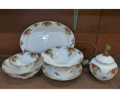 Six items of Royal Albert Old Country Roses; four bowls, a lamp base and a large oval plate