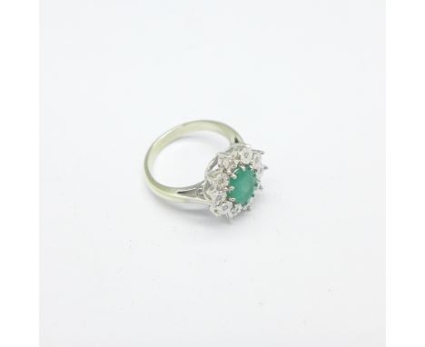 A 9ct gold, emerald and diamond cluster ring, 4.6g, K