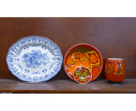 Three pieces of Poole pottery and a blue and white meat platter, height of vase 15.5cm