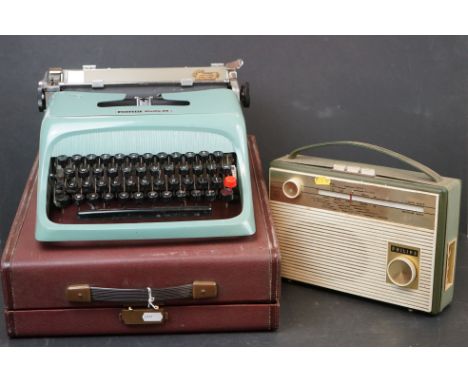 A Olivetti Studio 44 typewriter in baby blue together with a Philips radio. 