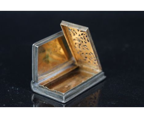 An antique fully hallmarked sterling silver vinaigrette in the form of a book. 