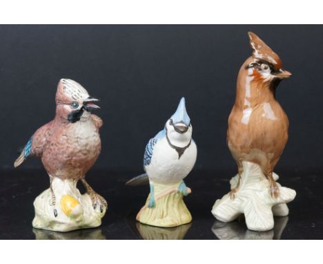 A collection of three ceramic birds to include a Beswick Jay (2417) together with a goebel example and a Beswick Blue Jay. 