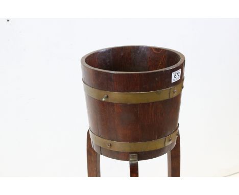 Early 20th century Oak ' Lister &amp; Co Ltd, Dursley ' Brass Bound Planter on Stand, 91cms high 