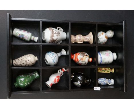 Franklin Mint Set of Thirteen miniature Oriental ceramic vases and jars contained within a collectors cabinet. 