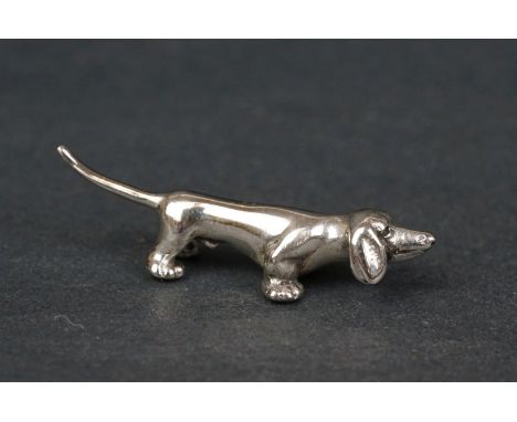 Silver figure of a dog / hound 