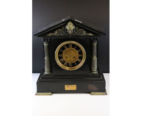 Victorian Slate Mantle Clock of architectural form with brass Corinthian column supports, the ebonised and gilt dial with Rom