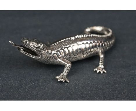 Silver figure of a lizard 